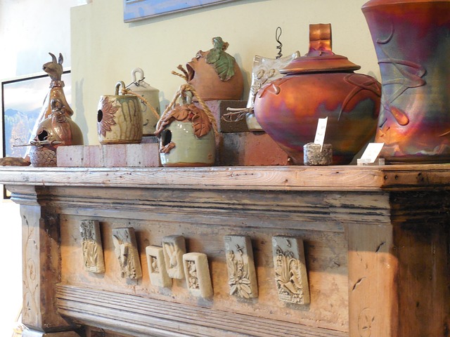 Fire place mantle with ornate pottery on top of it